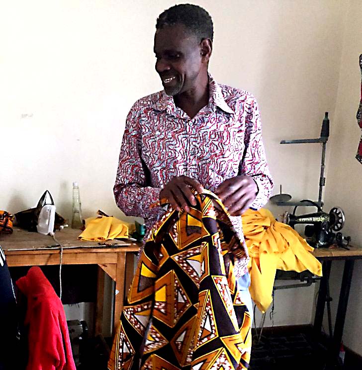 Fredrik Atinga, founder of Dolas Creation in his studio in Kibera, Nairobi